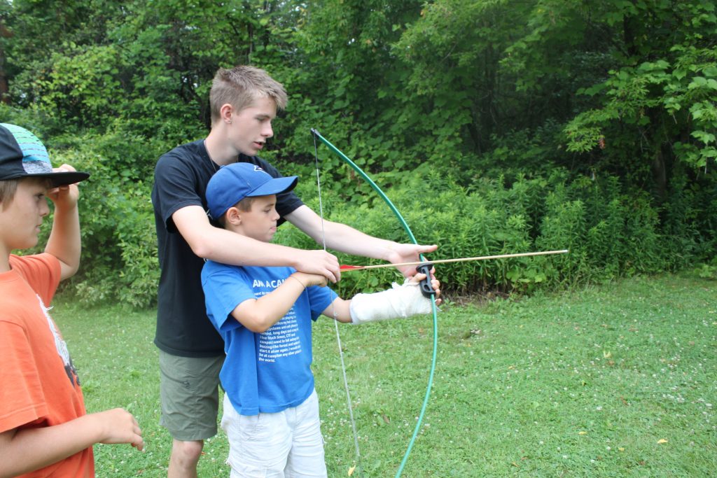 counsellor helps with archery